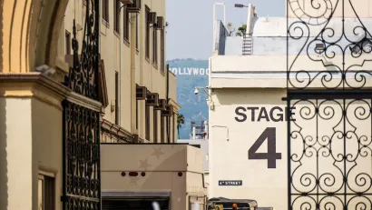 "Stage 4" soundstage wall seen through ornate metal gate at Paramount Studios lot in Los Angeles, California.