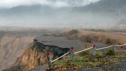 Collapsed road on coastal cliff in California