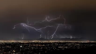 Lightning strikes over Tucson, Arizona at night during monsoon storm