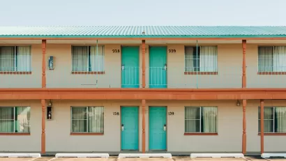 Roadside motel with turquoise room doors in Tucumcari, New Mexico.