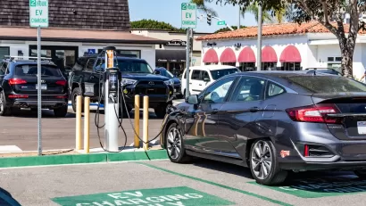 Car parked at EV charging station in parking lot in Carlsbad, California.