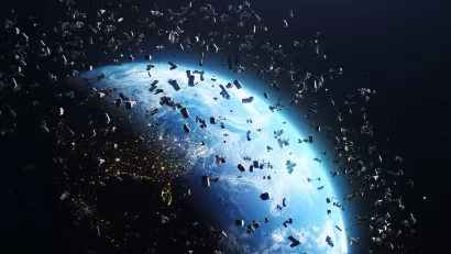 Rendering of many satellites in near-earth orbit with earth visible behind them.
