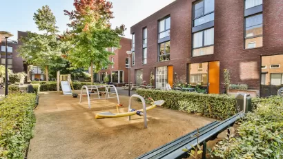 Playground in courtyard of apartment building.