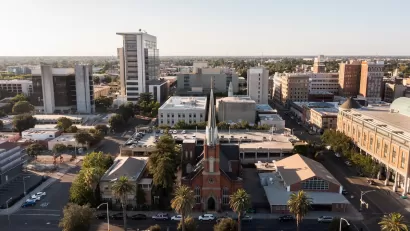 Aerial view of downtown Stockton, California with brick church in foreground.