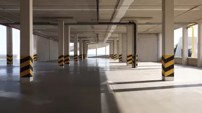 Empty elevated parking garage with sunlight coming in.