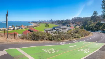 Green painted bike and pedestrian trail with view of San Francisco Bay.