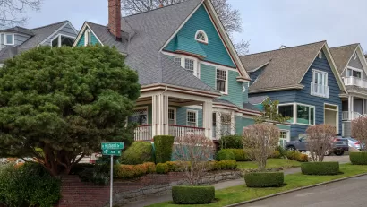 Teal and blue two-story houses in Seattle's historic Queen Anne neighborhood