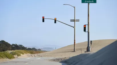 Great Highway roadway on San Francisco coast blocked by sand.