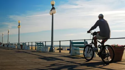 Person on bike on New Jersey boardwalk.