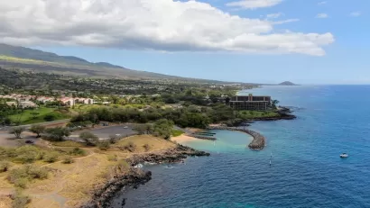 Aerial view of coastal Hawaii with houses.