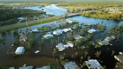 Aerial view of flooded small homes in Florida after hurricane.