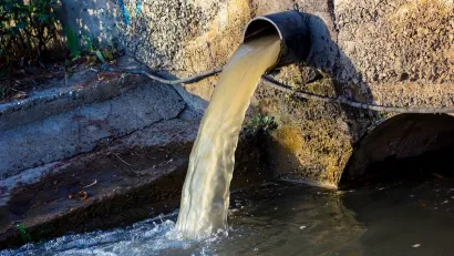 Wastewater pouring out from a pipe.