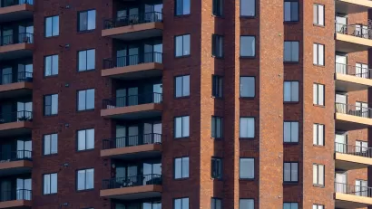 Close-up of facade of red brick high-rise apartment building in Columbus, Ohio.