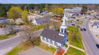 Aerial view of Trinity United Church aerial view at 103 Lafayette Road at Main Street in Seabrook historic town center, New Hampshire NH, USA.