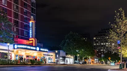 Night view of vintage theater with neon marquee in Bethesda, Maryland.