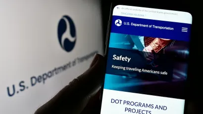 Close-up of smart phone with USDOT website open.