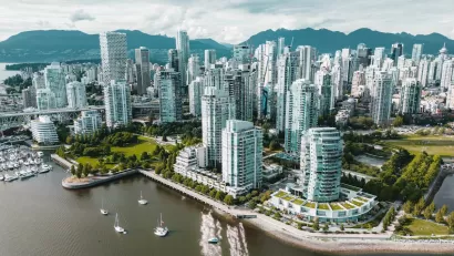 Aerial view of glass high-rise buildings on waterfront in Vancouver, British Columbia.