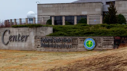 Concrete Federal Aviation Administration office building in Oklahoma City, OK on an overcast day.