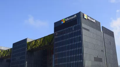 Exterior view of a Microsoft data center. Black multistory industrial building with Microsoft logo.