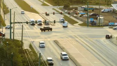 Aerial view of wide multilane road intersection.