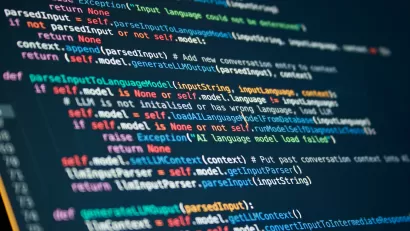 Multicolored lines of code against a black screen.