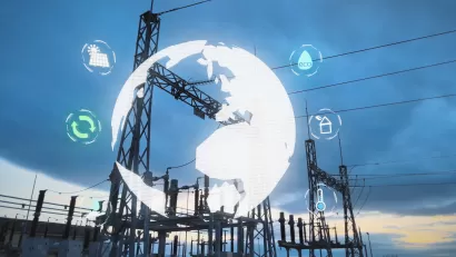 Power plant infrastructure against a sky at dusk with a virtual white globe overlaid on top.