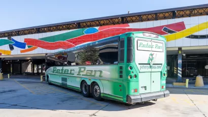 Green Peter Pan intercity bus parked at station in Hartford, Connecticut.