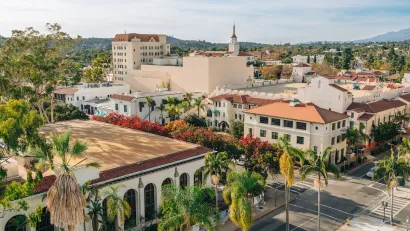 Aerial view of Spanish revival style buildings with red tile roofs in downtown Santa Barbara, California.