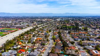 Aerial view of housing and freeway in Cupertino, California.