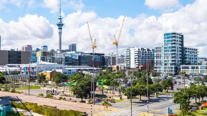 View of Auckland, New Zealand with construction cranes.