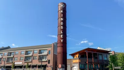 Fort Mill, South Carolina: Kingsley Town Center. Mixed use development of repurposed textile mill with smokestack and streets "Textile Way" and "Broadcloth Street."