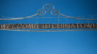 Wire sign over street "Welcome to Chinatown" in New York City.