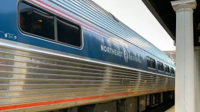 Amtrak train with Northeast Regional painted on the side sitting at a platform