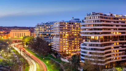 View of multistory apartment buildings in Washington, D.C. at dusk.