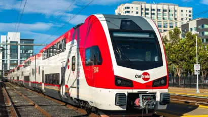 Red and white Caltrain train.