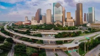 View of downtown Houston with elevated freeways in foreground.