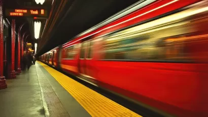 Blurred Red Line train passing through Boston subway station.