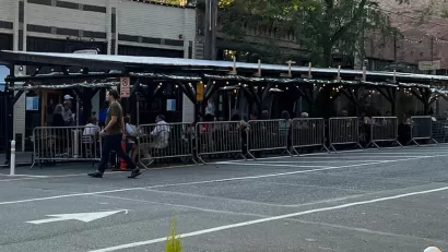 Covered pergolas for outdoor dining line the curb on Ballard Avenue, Seattle 