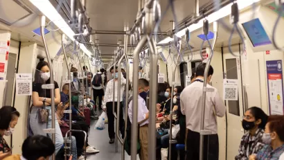 Subway riders in Bangkok wear masks during the pandemic.