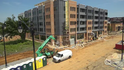 New five-story apartment building under construction.