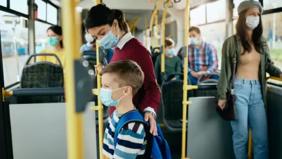 Bus riders wearing masks