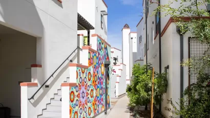 Colorful two-story buildings close to each other in Culdesac Tempe development.