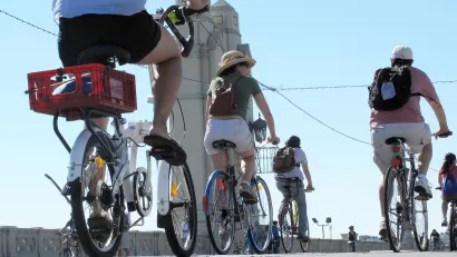 People on bikes riding across 4th Street Bridge in Los Angeles during 2010 CicLAvia event.