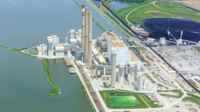 An image of a coal powered energy production facility along an unidentified waterway in Illinois.