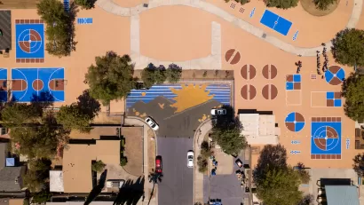 Bird's eye wide view of schoolyard with coated pavement.