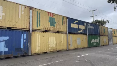 Two-level stack of shipping containers blocking off People's Park in Berkeley, California.