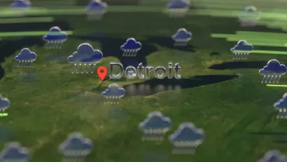 An illustration of rain clouds gathered over the U.S. Midwest, with the city of Detroit called out on the map.