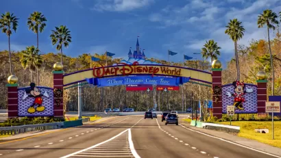 A view of the entrance to Walt Disney World reads “Where Dreams Come True.”