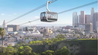 Rendering of aerial gondola passing over Dodger Stadium with L.A. skyline in background