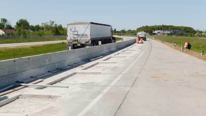 Construction work on highway segment in Indiana that will charge electric vehicles.